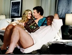 L-R Sarah Jessica Parker, Mr. Big, and Mr. Bigger relax in bed before getting ready for a heady evening of word salad and romance.