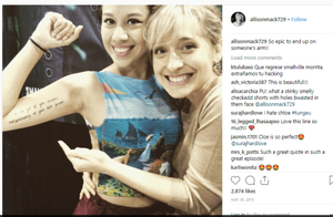 The writing is a quote from Allison Mack's character Chloe Sullivan in Smallville: "I'm the girl of your dreams masquerading as your best friend." It is from an episode where Chloe reads a letter aloud to a sleeping Clark Kent - revealing to the audience that she is in love with him.