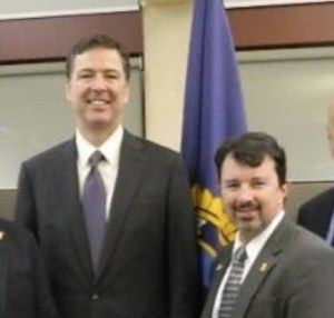 Dr. J. Richard Kiper with FBI Director James Comey.