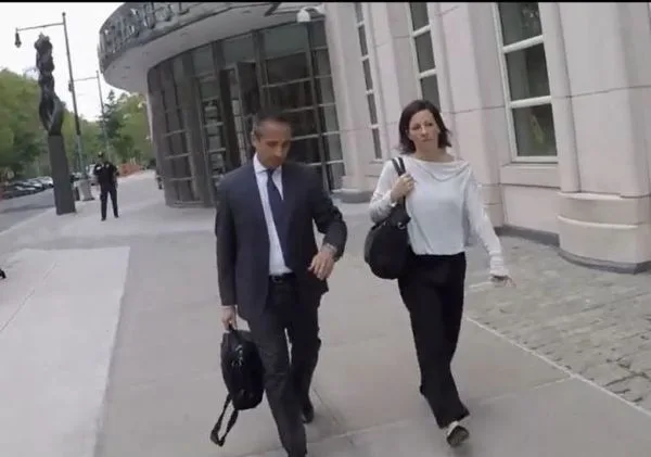 Lauren Salzman leaving court with her attorney, Hector Diaz