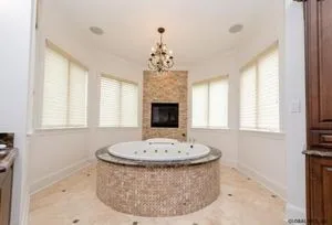 Sara Bronfman bathroom with circular tub
