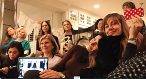 Women of Nxivm. Esther Chiappone Carlson holds a computer on her lap.