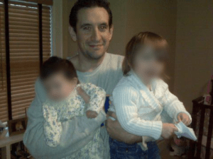 Allan Kassenoff holding his daughters