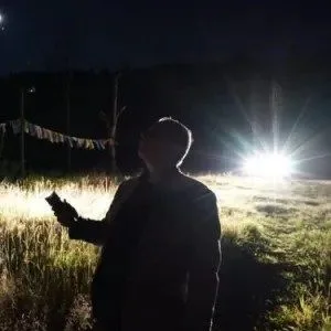 Lost-Women-of-Nxivm-Still-Frank-Backlit-by-Headlights.jpg