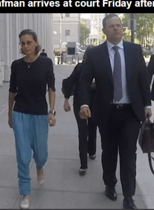 John Sandweg walks with Clare Bronfman to court.