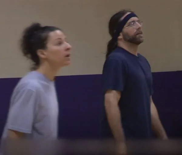 Lauren Salzman and Keith Raniere on the volleyball court.