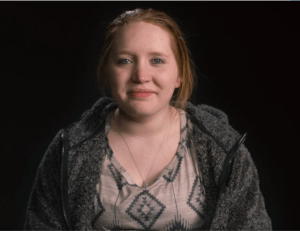 Carysa Long, seemingly without tics, is suing for psychological damage.