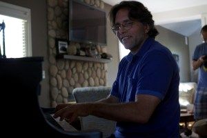Keith Raniere playing piano at Nancy Salzman's house