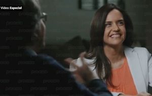 Clara Luz Flores enjoying a convivial conversation with a man she claims she never heard of -- Keith Raniere