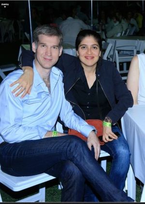 Ms. Garza with her husband Omar Boone who also has a green sash. Ms. Garza has Keith Raniere's initials one inch from her vagina as a symbol of her obedience to Mr. Raniere.
