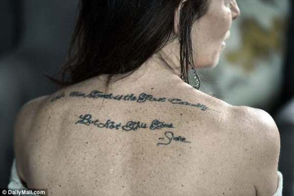 Toni Natalie has a tattoo on her back which reads - "‘In War, Truth is the First Casualty. . . But Not This Time” --or so she says.