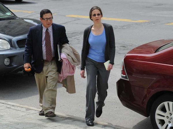 William Savino, attorney with his client Clare Bronfman.