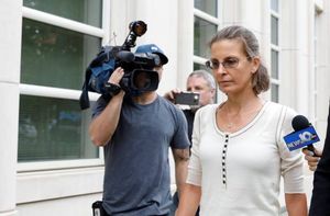 Clare Bronfman heads to court enjoying the attention of the media.