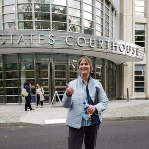 Susan Dones stands outside of the US Courthouse where Keith Raniere was convicted and sentenced. Dones spoke at his sentencing and the judge added abo