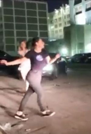 DOS women dancing in front of Raniere's prison.