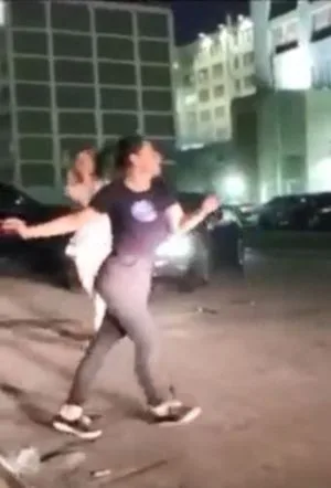 DOS women dancing in front of Raniere's prison.