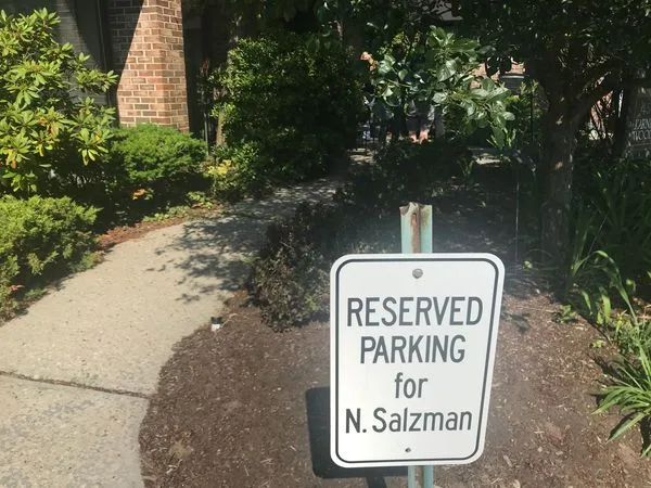 The sign is there and if you notice closely a screw is loose for Nancy Sazlman.