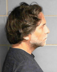Keith Raniere from a mug shot.