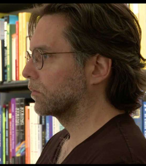 Keith Raniere in his library.