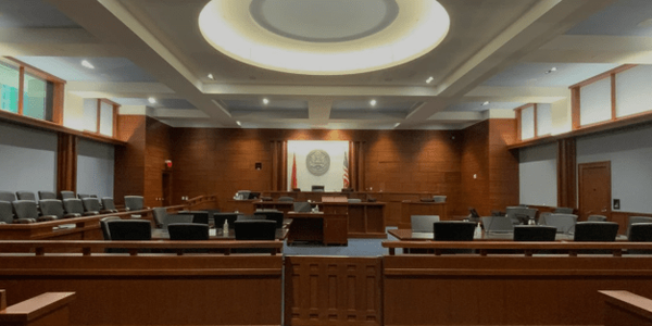 The procecution table is within feet of the jury.