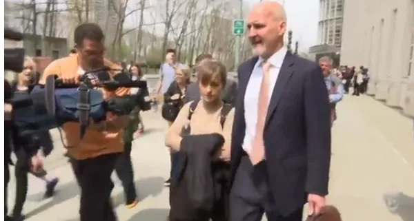 Allison Mack gets media attention after leaving the courthouse on April 8, 2019 after pleading guilty to two racketeering felonies and ending the prosecution against her for sex trafficking, sex trafficking conspiracy and forced labor conspiracy.