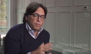 Keith Raniere said at V-Week 2016: "I am very devilish. I think I am probably the worst coach in the world because I am just a demon. You know if I am coaching you I am going to have you do something with your left hand, you're right hand, your left foot, you're right foot, your head, and then I am going to ask you to do the hard thing. 

I do this and it is with a twisted sense of pleasure in someways. The extra effort being able to pull effort out of others and Pull effort out of myself. So here we are coming into V week. And the people involved in simply human and other things there. I can't tell you how much they took on this year. The artistic and musical piece that you saw  was original. Completely.