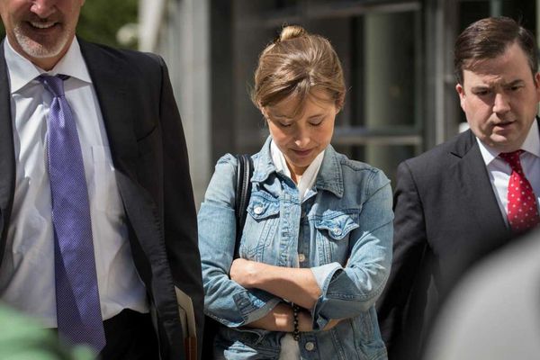 Allison Mack outside federal court with her attorneys.