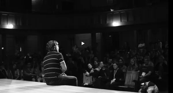 Keith Alan Raniere AKA Vanguard on stage at V-Week talking to his mostly female followers.