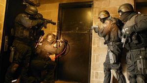 A Law Enforcement team prepares a breach operation. 