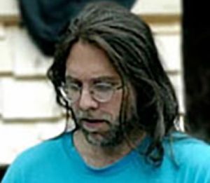 Keith Raniere in deep thought on how to improve the lot of women. In this 2007 picture he is working on the improvement of one of his harem women, Pamela Cafitz who he kept under constant surveillance keeping precise track of her diet and exercise regime. Miss Cafritz died Nov, 2016.