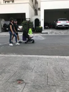 Keith Raniere pushes the stroller wherein lies baby Kemar in a gated community in San Pedro Garza Garcia. Marianna Fernandez, the mother, walks beside him. Raniere was in hiding there to avoid being arrested by the FBI and was discovered by the Frank Report.Kemar is now one and a half and his mother is Mariana Fernandez, one of his DOS slaves and longtime harem member.