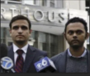 Suneel [right] with Eduardo Asunsolo tell the media that the FBI framed Raniere.