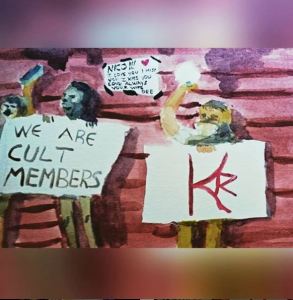 The DOS dancers hold up a sign with the pubic brand. MK10ART