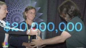NXIVM-American-Greed-Sara-Bronfman-Clare-Bronfman-Present-Check-to-Keith-Raniere