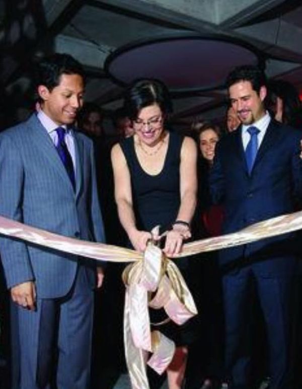 Nancy [Prefect] Salzman cuts the ribbon opening up the Mexico NXIVM center. Alex Betancourt [l] and Emiliano Salinas [R].