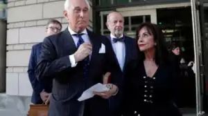 Roger Stone, left, with his wife Nydia Stone, leaves federal court in Washington, Friday, Nov. 15, 2019. Stone, a longtime friend of President Donald Trump, has been found guilty at his trial in federal court in Washington. (AP Photo/Julio Cortez)