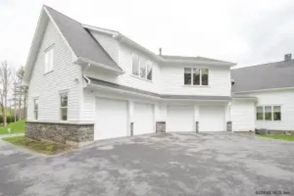 Vinyl is final - but it may be wood that sides the back and sides of Sara Bronfman's home in Clifton Park.