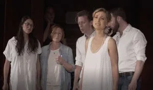 Simply Human performs on stage - at Vanguard Week - with Allison Mack and Siobhan Hotaling as lead singers for Raniere's birthday August 26, 2016