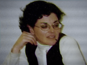 Nancy Salzman in White Shirt and Black Vest