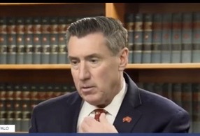 Former DA John Flynn’s Accuser Speaks From Jail as Case File Reveals New Details
