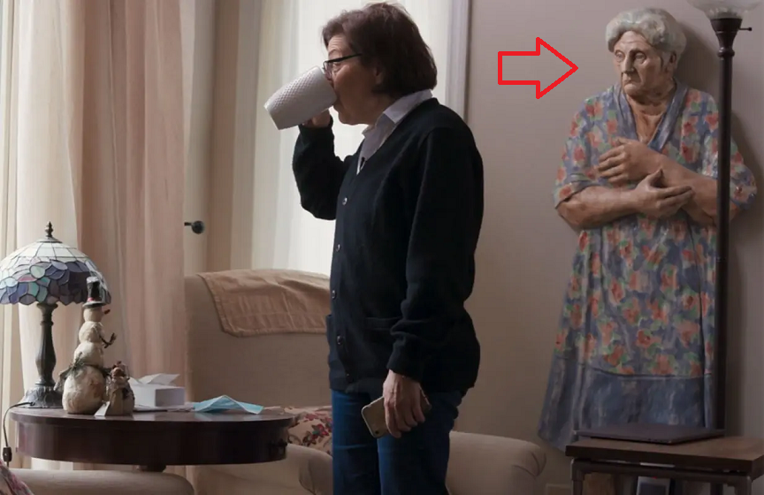 Creepy or Funny: What’s that Behind Nancy Salzman?