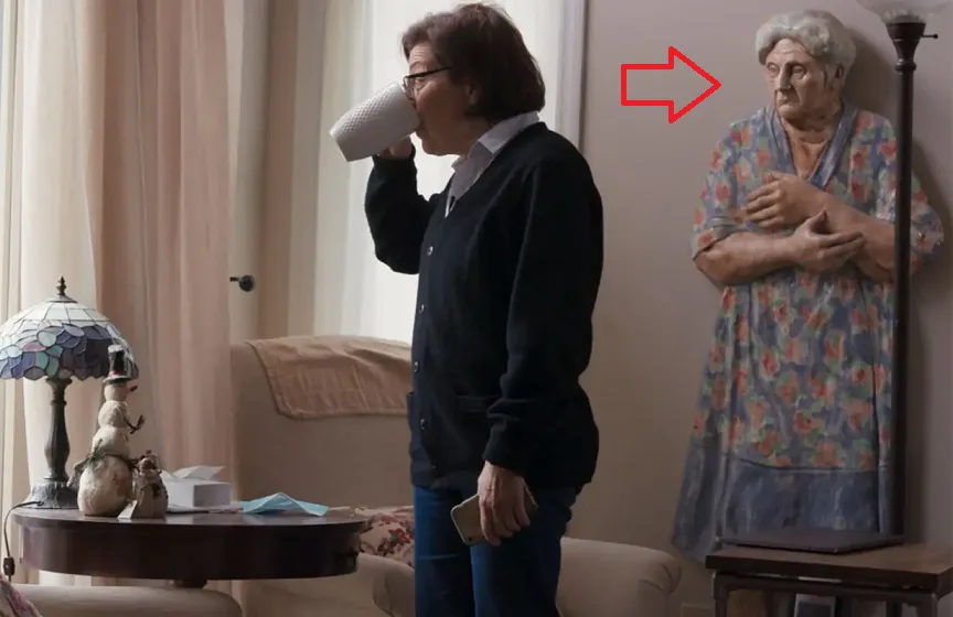 Creepy or Funny: What’s that Behind Nancy Salzman?
