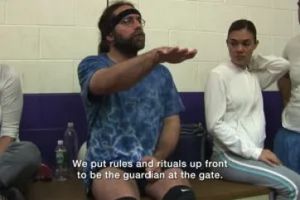 Keith Raniere displays erudite wisdom and his legs during a discourse at volleyball.