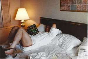 Vanguard is studying a book while resting in bed
