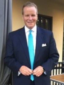 A story is told of how attorney John Guttridge turned up at an important hearing concerning his partner Jo-Ann Cambareri's alleged illegal email communications with a litigant. Attorney Guttridge sat in the back of Judge Lubell's courtroom and "stared down the judge."
