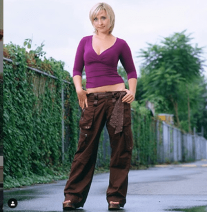 Allison Mack had gone from nicely proportioned [above].