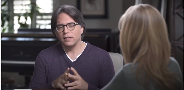 Keith Raniere speaks with his DOS slave Allison Mack