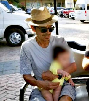 Camila's father Hector, with his grandson.