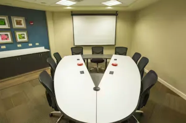 They met in a conference room at a hotel instead of a courtroom. This way they could keep nice and quiet.