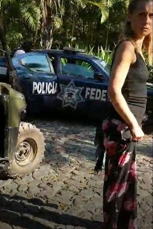 Allison Mack shows fear as Keith Raniere is being seated in the back of a Mexican federal police car. She and Lauren got in a car and followed police.